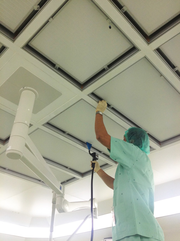 GMP Test engineer executing filter testing in a cleanroom